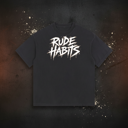 A black short-sleeve t-shirt with a distressed white graphic on the chest reading 'RUDE HABITS' in a stylized, spray-paint-like font, shown against a plain white background.