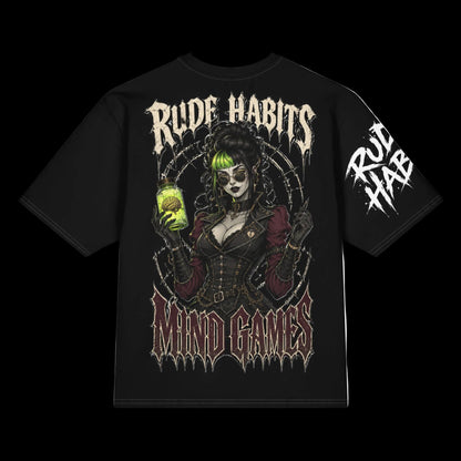 A black short-sleeve graphic t-shirt featuring a gothic-style illustration of a woman with green hair holding a glowing jar, with the text 'RUDE HABITS' and 'MIND GAMES' on the front, plus a sleeve print.